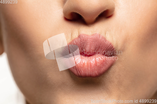 Image of Close-up shoot of beautiful female lips with natural lipstick make up