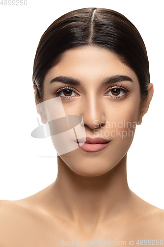 Image of Portrait of beautiful jewish woman isolated on white studio background. Beauty, fashion, skincare, cosmetics concept.