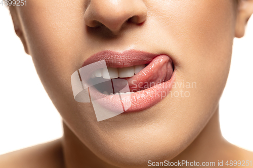 Image of Close-up shoot of beautiful female lips with natural lipstick make up