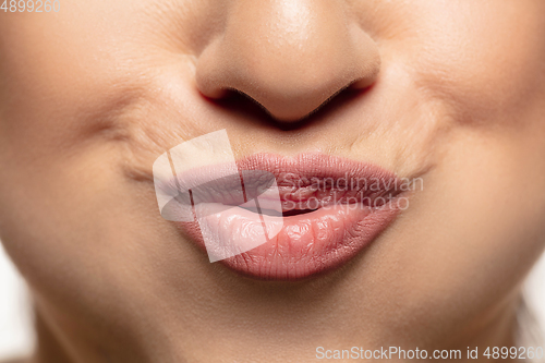 Image of Close-up shoot of beautiful female lips with natural lipstick make up