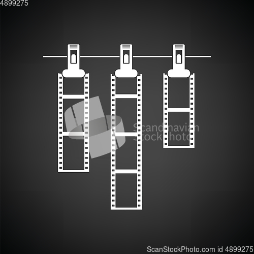 Image of Icon of photo film drying on rope with clothespin
