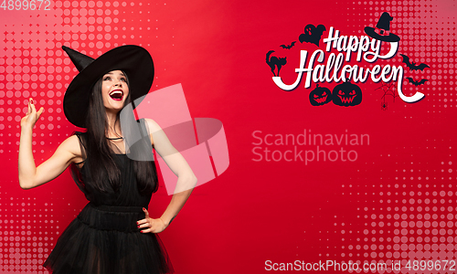 Image of Young woman a witch on scary background