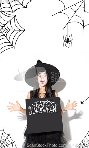 Image of Young woman a witch on scary background
