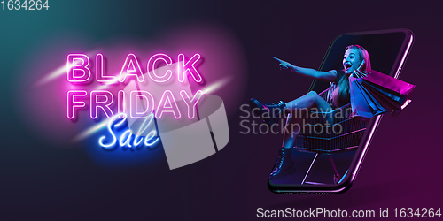 Image of Beautiful woman inviting for shopping right from device screen, black friday, sales concept. Flyer with copyspace