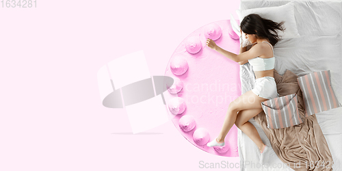 Image of Portrait of a young girl sleeping and dreaming about cake