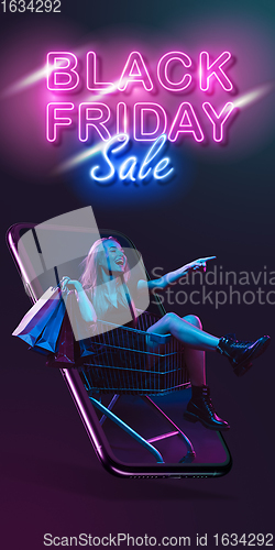 Image of Beautiful woman inviting for shopping right from device screen, black friday, sales concept. Flyer with copyspace