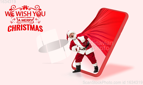 Image of Emotional Santa Claus greeting with New Year 2021 and Christmas. Flyer with copyspace