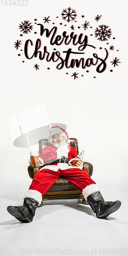 Image of Emotional Santa Claus greeting with New Year 2021 and Christmas. Flyer with copyspace