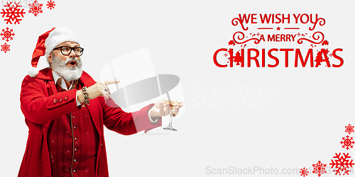 Image of Emotional Santa Claus greeting with New Year 2021 and Christmas. Flyer with copyspace