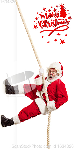 Image of Emotional Santa Claus greeting with New Year 2021 and Christmas. Flyer with copyspace