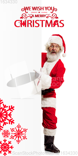 Image of Emotional Santa Claus greeting with New Year 2021 and Christmas. Flyer with copyspace