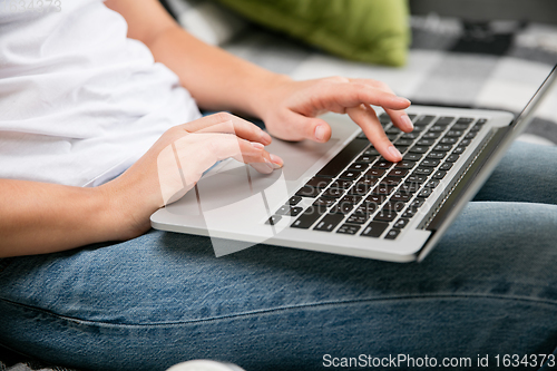 Image of Remote working from home. Workplace in home office with PC, devices and gadgets.