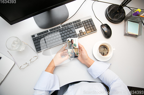 Image of Remote working from home. Workplace in home office with PC, devices and gadgets.