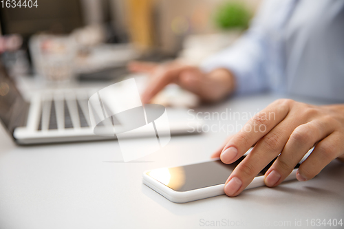 Image of Remote working from home. Workplace in home office with PC, devices and gadgets.