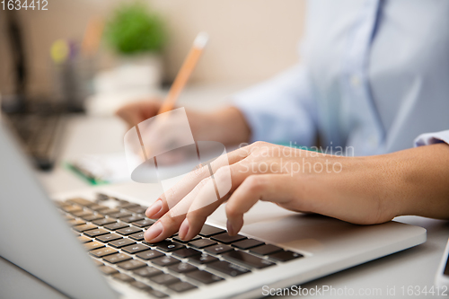 Image of Remote working from home. Workplace in home office with PC, devices and gadgets.