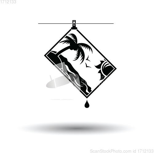 Image of Icon of photograph drying on rope