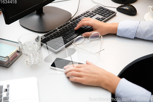 Image of Remote working from home. Workplace in home office with PC, devices and gadgets.