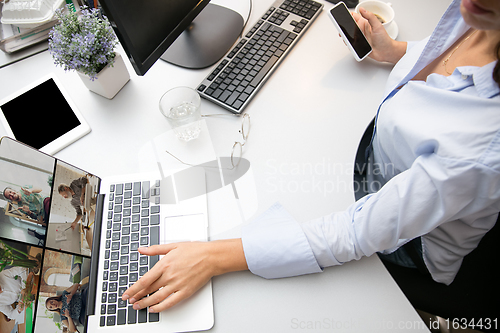 Image of Remote working from home. Workplace in home office with PC, devices and gadgets.