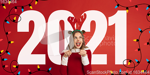 Image of Emotional Santa Claus\' deer greeting with New Year 2021 and Christmas. Flyer with copyspace