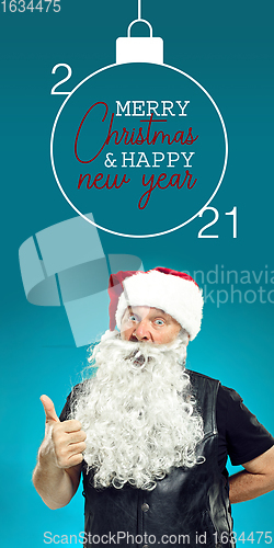 Image of Emotional Santa Claus greeting with New Year 2021 and Christmas. Flyer with copyspace