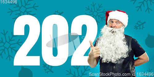 Image of Emotional Santa Claus greeting with New Year 2021 and Christmas. Flyer with copyspace