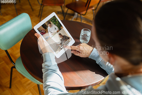 Image of Remote working. Workplace in bar, restaurant office with PC, devices and gadgets.