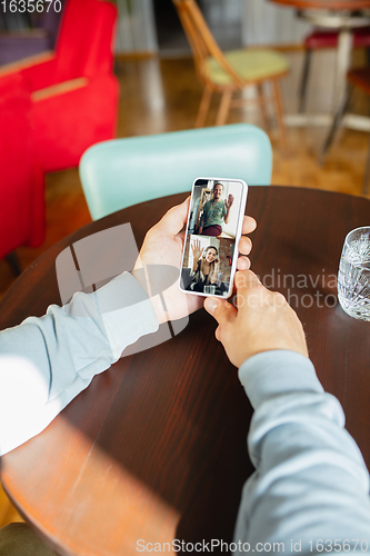 Image of Remote working. Workplace in bar, restaurant office with PC, devices and gadgets.