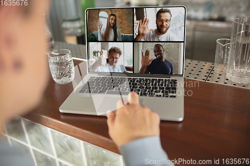 Image of Remote working. Workplace in bar, restaurant office with PC, devices and gadgets.