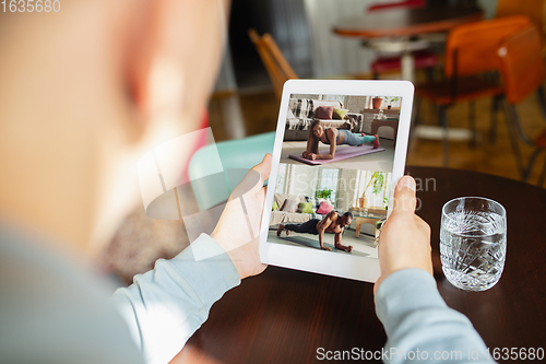 Image of Remote working. Workplace in bar, restaurant office with PC, devices and gadgets.