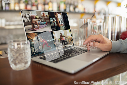 Image of Remote working. Workplace in bar, restaurant office with PC, devices and gadgets.