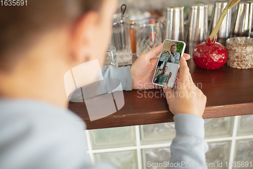 Image of Remote working. Workplace in bar, restaurant office with PC, devices and gadgets.