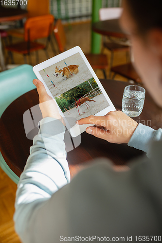 Image of Remote working. Workplace in bar, restaurant office with PC, devices and gadgets.