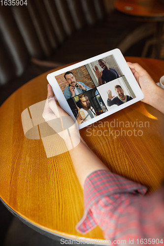 Image of Remote working. Workplace in bar, restaurant office with PC, devices and gadgets.