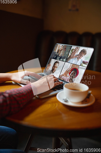 Image of Remote working. Workplace in bar, restaurant office with PC, devices and gadgets.