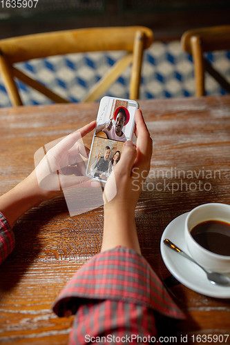 Image of Remote working. Workplace in bar, restaurant office with PC, devices and gadgets.