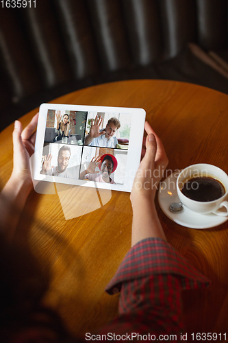 Image of Remote working. Workplace in bar, restaurant office with PC, devices and gadgets.