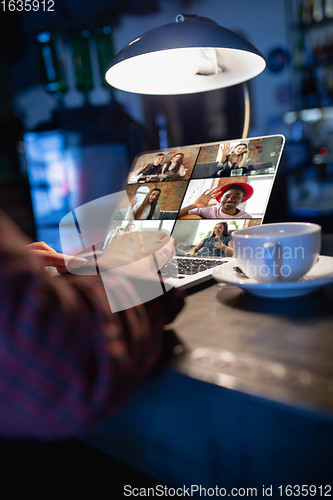 Image of Remote working. Workplace in bar, restaurant office with PC, devices and gadgets.