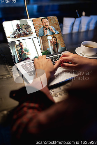 Image of Remote working. Workplace in bar, restaurant office with PC, devices and gadgets.