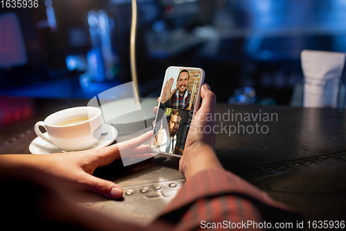 Image of Remote working. Workplace in bar, restaurant office with PC, devices and gadgets.