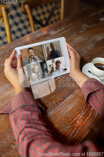 Image of Remote working. Workplace in bar, restaurant office with PC, devices and gadgets.