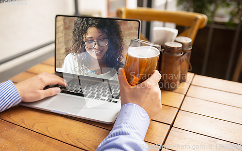 Image of Remote working, online entertainment during quarantine. Remote events in bar, restaurant office with PC, devices and gadgets.