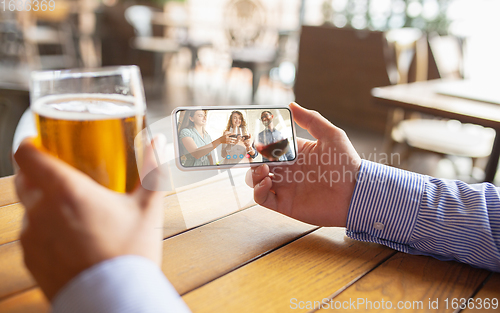 Image of Remote working, online entertainment during quarantine. Remote events in bar, restaurant office with PC, devices and gadgets.