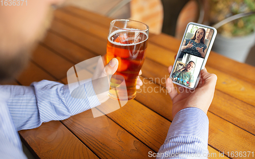 Image of Remote working, online entertainment during quarantine. Remote events in bar, restaurant office with PC, devices and gadgets.