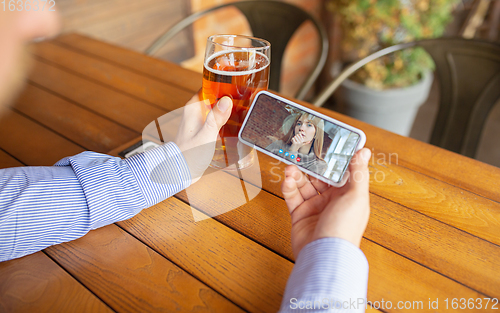 Image of Remote working, online entertainment during quarantine. Remote events in bar, restaurant office with PC, devices and gadgets.