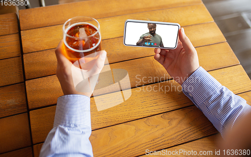 Image of Remote working, online entertainment during quarantine. Remote events in bar, restaurant office with PC, devices and gadgets.