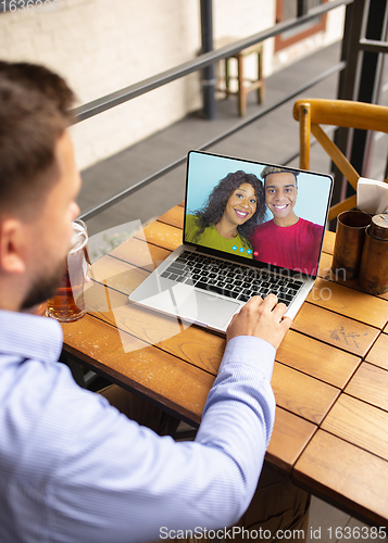 Image of Remote working, online entertainment during quarantine. Remote events in bar, restaurant office with PC, devices and gadgets.