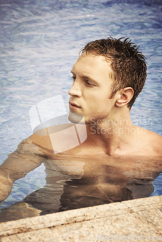 Image of Man swimming in the pool