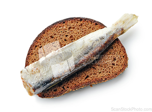 Image of canned sardine on bread slice