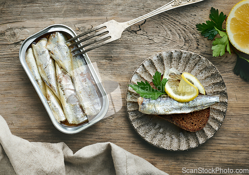 Image of open sardines can