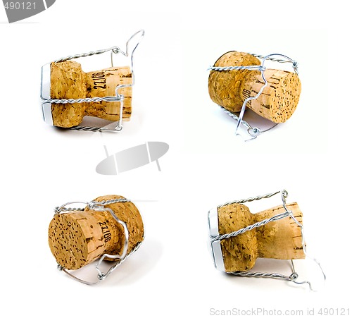 Image of four champagne corks